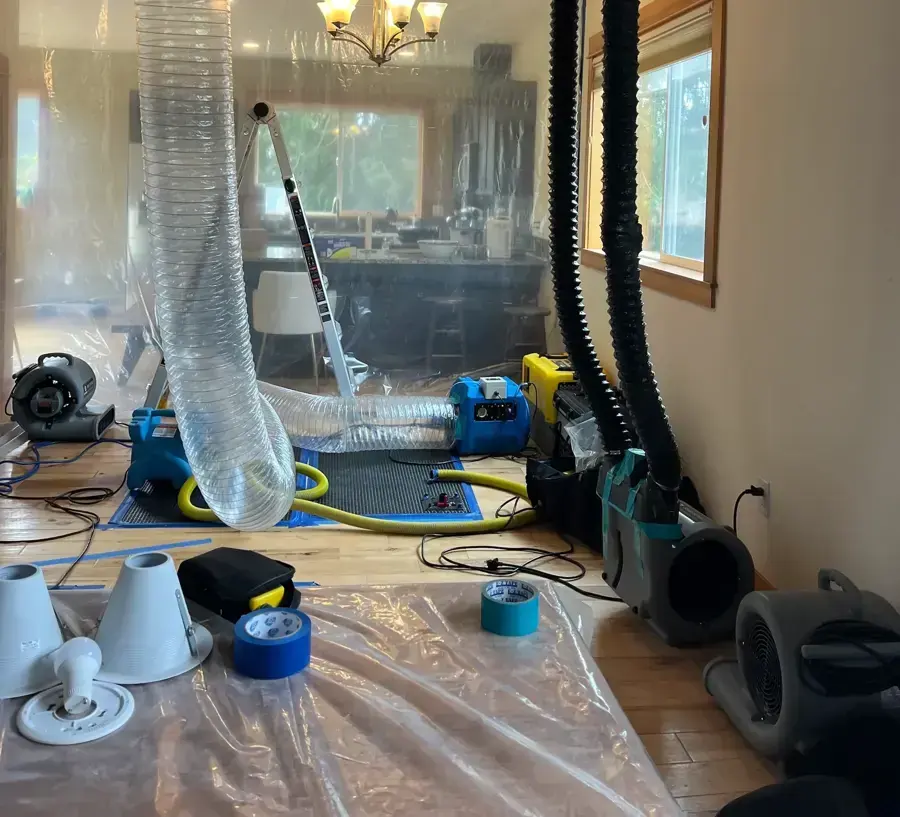 Plastic containment, ducting and air movers set up during a Wilmington dry-out